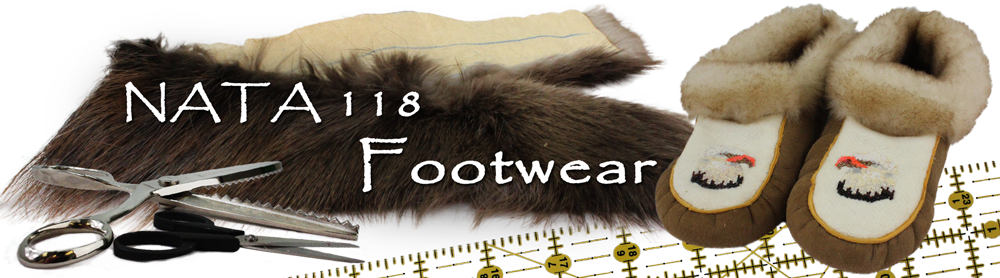 scissors, ruler and moccasins on top of strip of fur